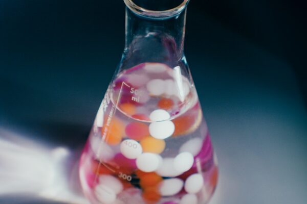 pink and white heart shaped candies in clear glass jar