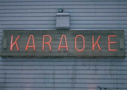 a neon sign on the side of a building