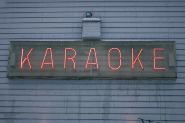 a neon sign on the side of a building